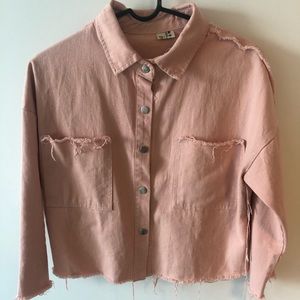Distressed pink denim jacket